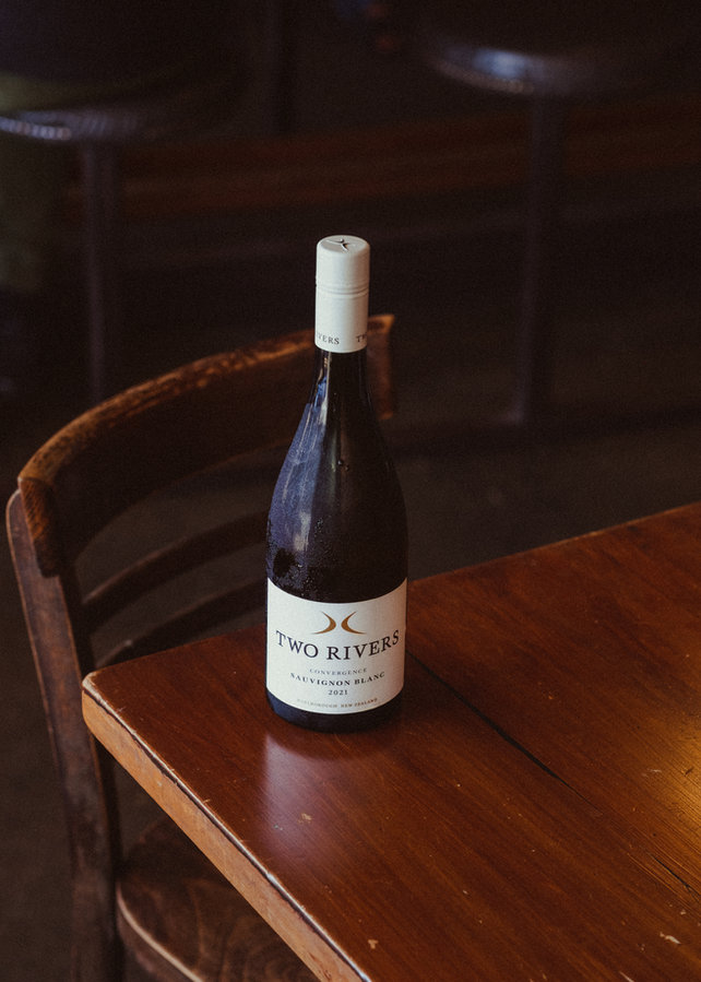 A bottle of wine on a table at Raumati Social Club